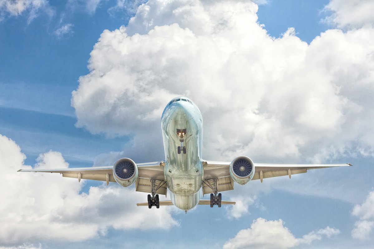 An aircraft in flight against a blue sky